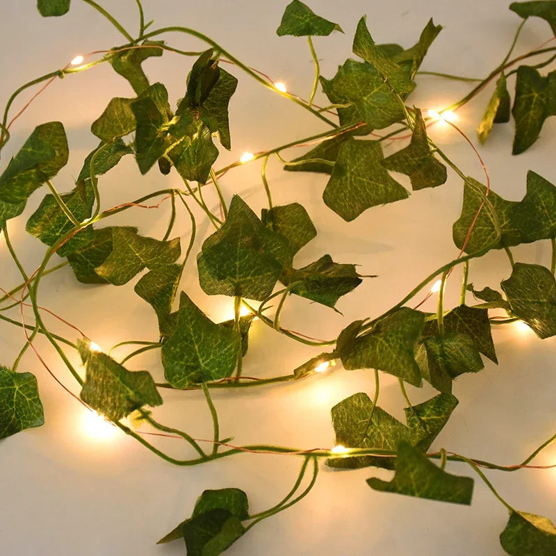 2M / 5M / 10M LED Silk Leaf Ivy Vine String Lights – Artificial Greenery Garland for Home, Wedding, and Event Decoration. Features realistic silk leaves and warm LED lighting, perfect for creating elegant, nature-inspired d