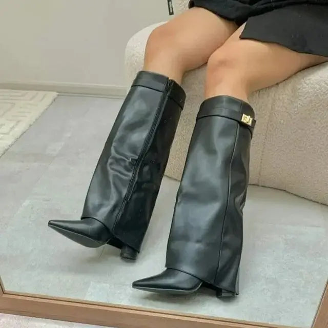 2025 Autumn/Winter Collection – Women’s Pointed-Toe Knee-High Boots with Metal Buckle. Featuring a thick high heel and sleek mid-leg design for a chic, fashionable look. Perfect for pairing with dresses or pants for elega