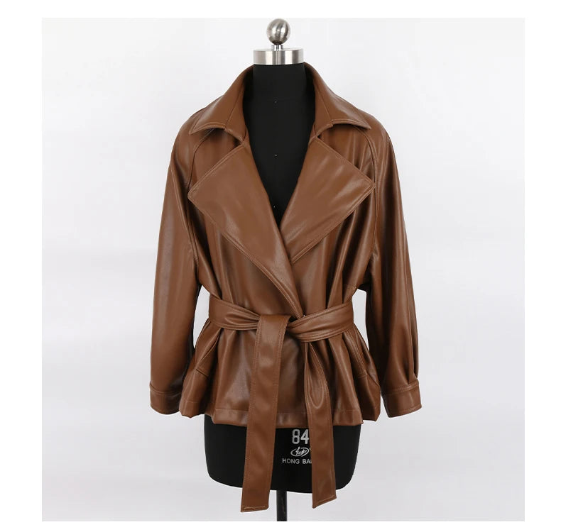 Mauroicardi 2025 Spring/Fall Collection – Women’s Short PU Leather Jacket. Crafted from soft, lightweight material with a fitted silhouette, raglan sleeves, and stylish sash detailing. Available in elegant brown and class