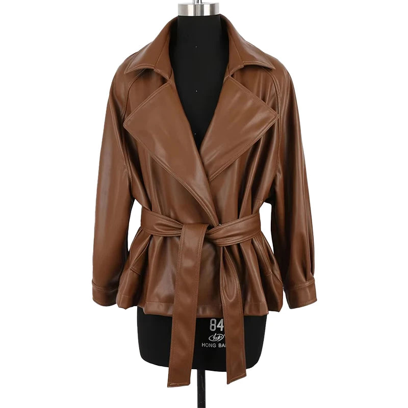 Mauroicardi 2025 Spring/Fall Collection – Women’s Short PU Leather Jacket. Crafted from soft, lightweight material with a fitted silhouette, raglan sleeves, and stylish sash detailing. Available in elegant brown and class
