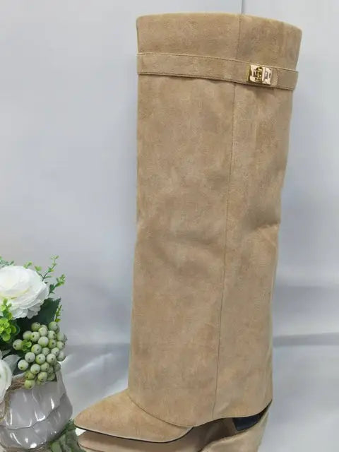 2025 Autumn/Winter Collection – Women’s Pointed-Toe Knee-High Boots with Metal Buckle. Featuring a thick high heel and sleek mid-leg design for a chic, fashionable look. Perfect for pairing with dresses or pants for elega