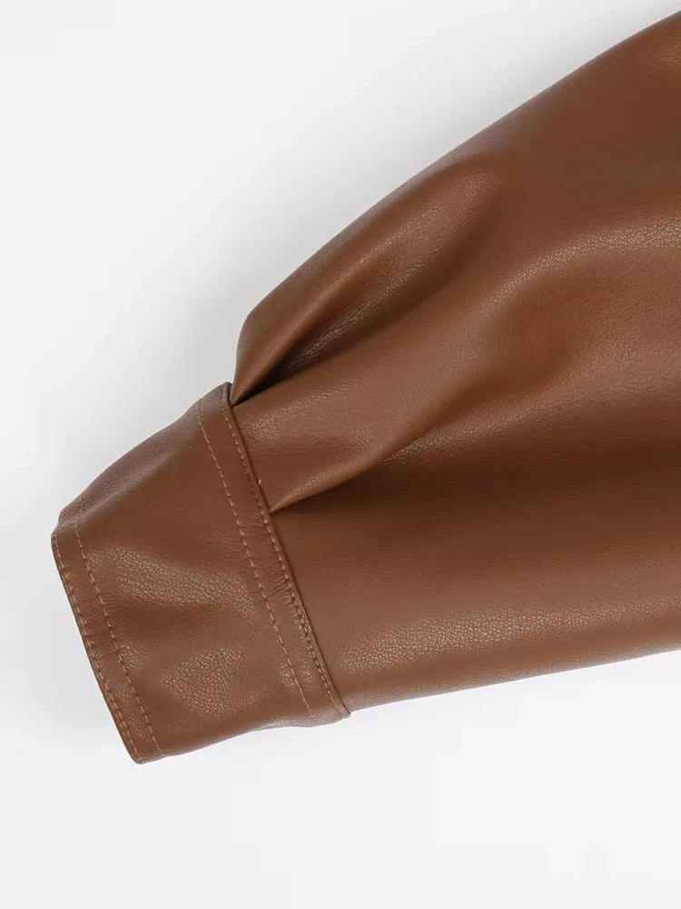 Mauroicardi 2025 Spring/Fall Collection – Women’s Short PU Leather Jacket. Crafted from soft, lightweight material with a fitted silhouette, raglan sleeves, and stylish sash detailing. Available in elegant brown and class