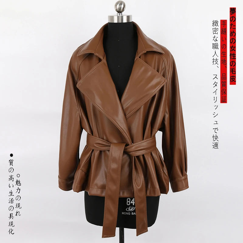 Mauroicardi 2025 Spring/Fall Collection – Women’s Short PU Leather Jacket. Crafted from soft, lightweight material with a fitted silhouette, raglan sleeves, and stylish sash detailing. Available in elegant brown and class