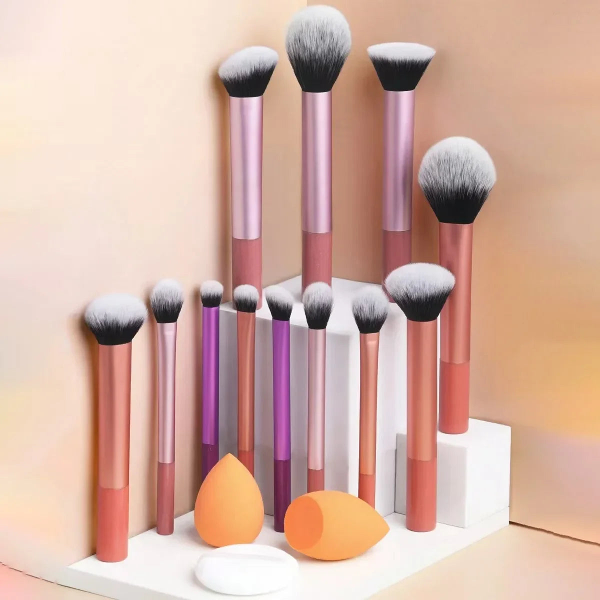 12-Piece Professional Makeup Brush Set with Sponges & Powder Puff. A complete makeup essential kit featuring high-quality brushes for eyeshadow, powder, and blush application. Includes 12 premium brushes, 2 blending sponges,