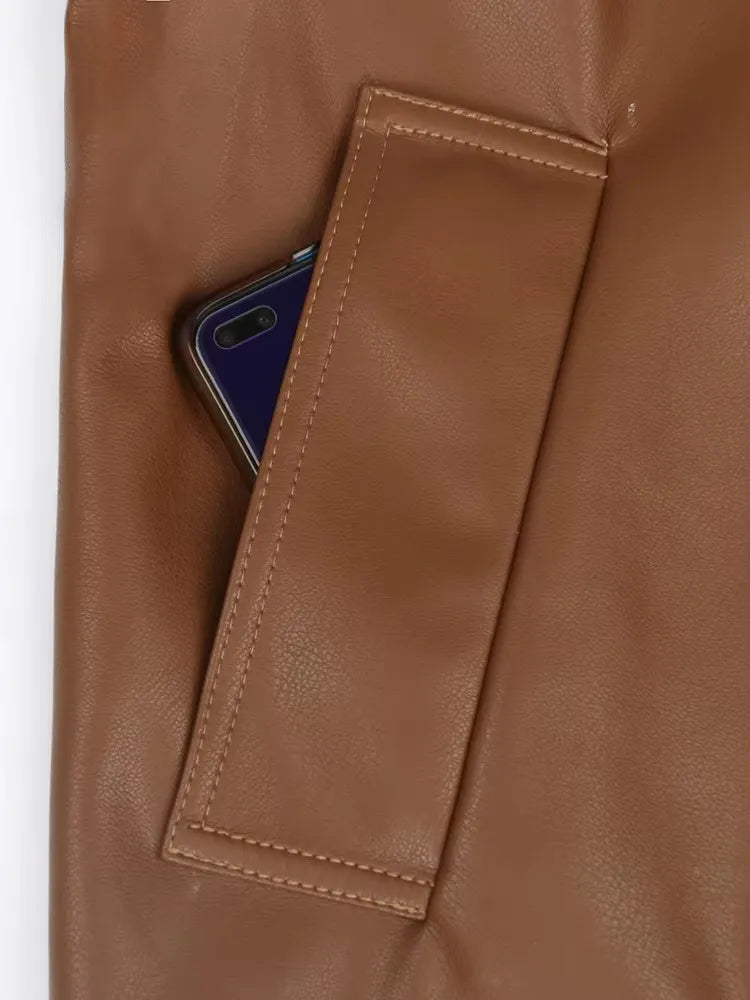 Mauroicardi 2025 Spring/Fall Collection – Women’s Short PU Leather Jacket. Crafted from soft, lightweight material with a fitted silhouette, raglan sleeves, and stylish sash detailing. Available in elegant brown and class